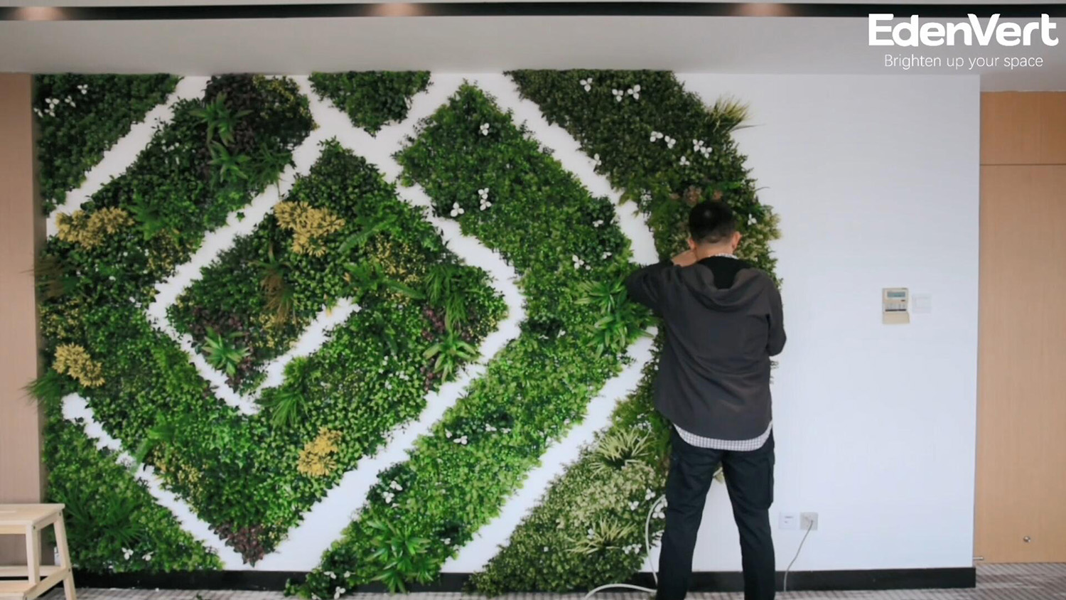 Easy installation of vertical garden wall in conference room