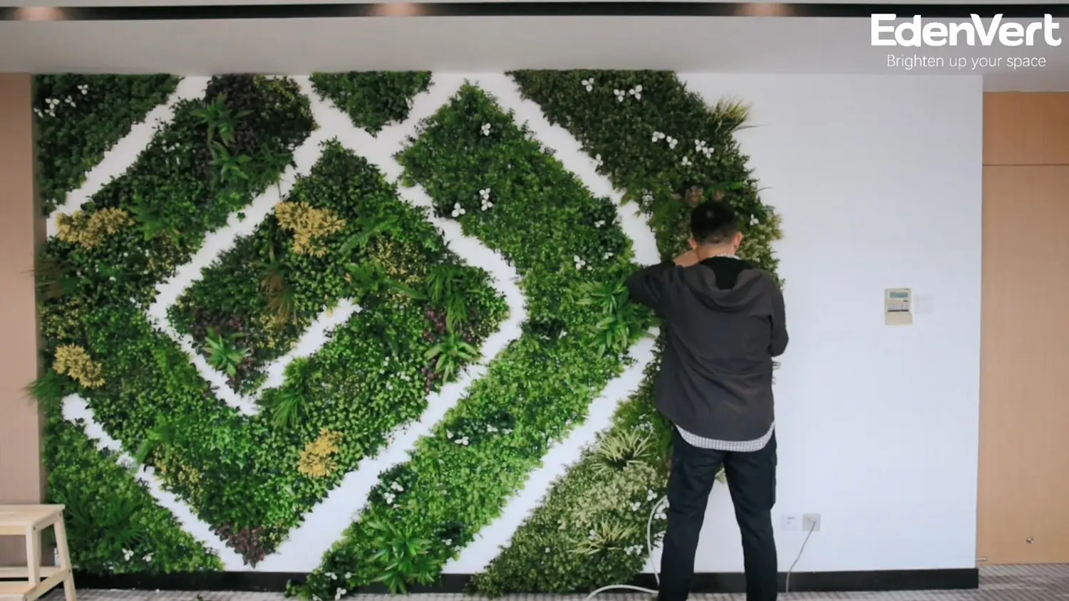 Easy installation of vertical garden wall in conference room