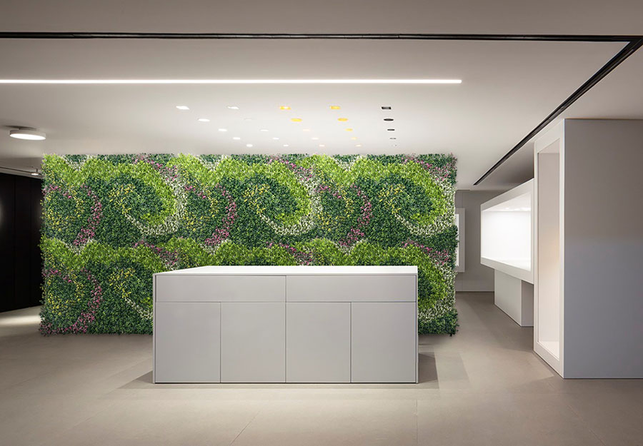 artificial green wall in office lobby