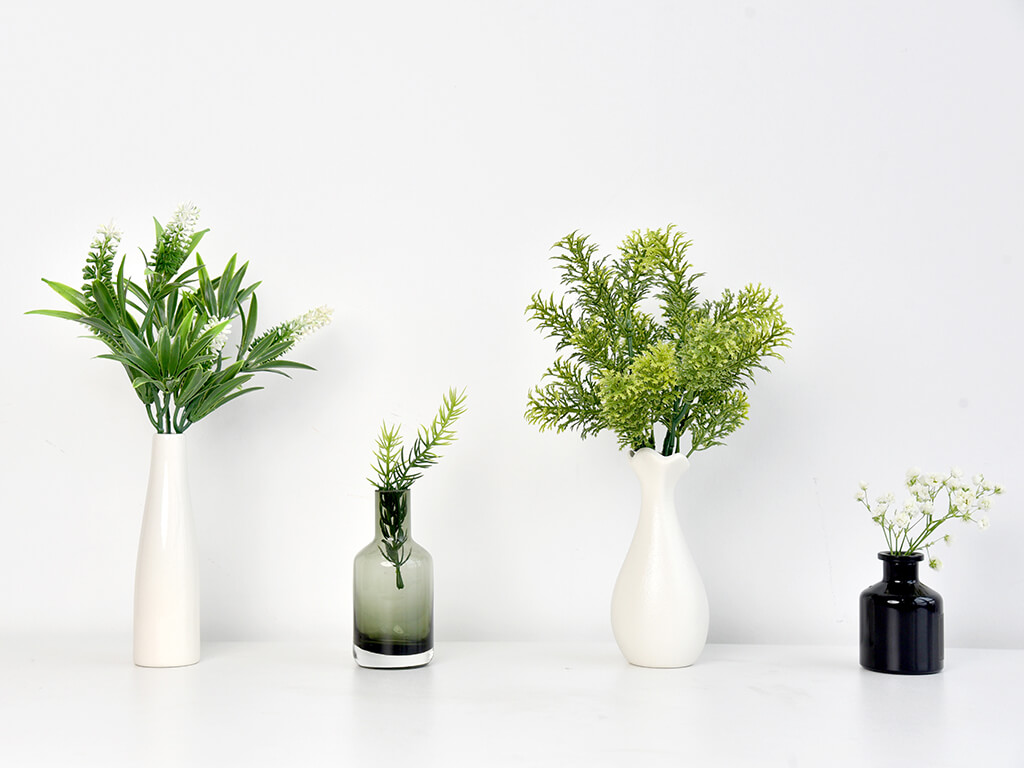 faux greenery branches in a vase